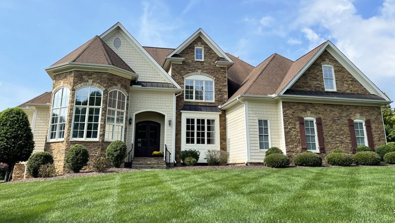 Renovated House With New Roof And Lawn